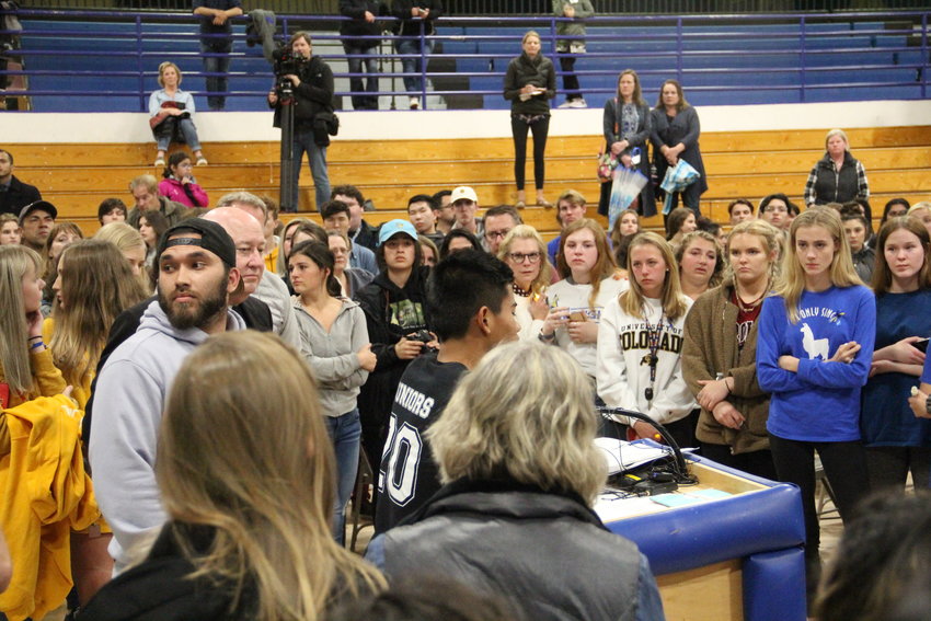 A student speaks during an impromptu succession of students, including STEM School students, who addressed the smaller crowd back in the gym after a large portion of it walked out into the hallway and outside Highlands Ranch High School. The May 8 vigil was in honor of STEM School shooting victims and survivors.